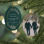 Laurel Leaf First Engaged Christmas Photo Ceramic Ornament<br><div class="desc">Celebrate your first Christmas as an engaged couple with this charming and festive ornament. Design features "our first Christmas engaged" in modern block and script lettering, surrounded by a faux gold foil border accented with green winter leaves. Personalise with your names and the year, and add a photo to the...</div>