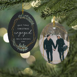 Laurel Leaf First Engaged Christmas Photo Ceramic Ornament<br><div class="desc">Celebrate your first Christmas as an engaged couple with this charming and festive ornament. Design features "our first Christmas engaged" in modern block and script lettering, surrounded by a faux gold foil border accented with green winter leaves. Personalise with your names and the year, and add a photo to the...</div>