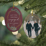 Laurel Leaf First Engaged Christmas Photo Ceramic Ornament<br><div class="desc">Celebrate your first Christmas as an engaged couple with this charming and festive ornament. Design features "our first Christmas engaged" in modern block and script lettering, surrounded by a faux gold foil border accented with green winter leaves. Personalise with your names and the year, and add a photo to the...</div>