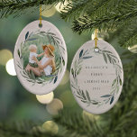 Laurel Wreath | Photo & Caption Christmas Ceramic Ornament<br><div class="desc">Elegant double sided photo ornament frames a favourite photo with an oval wreath of green watercolor laurel leaves on a light wood background. Personalise the back with your custom caption (shown with "[name's] first Christmas" and the year. Perfect for baby's first Christmas, first married Christmas, or to commemorate a special...</div>