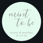 Lauren Mint Green Elegant Wedding Classic Round Sticker<br><div class="desc">Chic and modern wedding favour stickers with a minimal design featuring the message, "Mint To Be" in a hand writing font and your names and date below, in grey, over a mint green background. The fonts and background colours may be changed to any colours you wish. These elegant and stylish...</div>