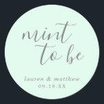 Lauren Mint Green Elegant Wedding Classic Round Sticker<br><div class="desc">Chic and modern wedding favour stickers with a minimal design featuring the message, "Mint To Be" in a hand writing font and your names and date below, in grey, over a mint green background. The fonts and background colours may be changed to any colours you wish. These elegant and stylish...</div>