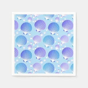 Lavender and blue seashells on pale blue napkin