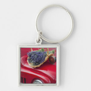 Lavender bunches rest on old farm pickup truck key ring