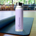 Lavender custom name script water bottle<br><div class="desc">Stay hydrated in style with this elegant lavender water bottle featuring a personalised name design. Crafted in a soft, modern lavender tone, this stainless steel bottle combines functionality with refined, feminine style. The sleek vertical name detail adds a custom touch, making it perfect for yoga classes, Pilates sessions, gym workouts,...</div>