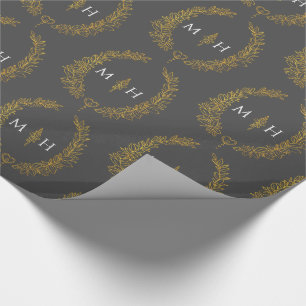 Leaf oval monogram drawing gold on dark grey wrapping paper