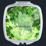 Leafy Wedding Bridesmaid Compact Mirror<br><div class="desc">This Bridesmaid compact mirror invites you to enter a leafy summer world of nature. Maple leaves frame a sunny woodland forest scene with shades of yellow,  white and green.  Customise the text for your special occasion.</div>