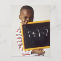 Learning arithmetic. 4-year-old boy holding a