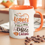 Leaves Are Falling Coffee Is Calling Cute Fall Mug<br><div class="desc">Embrace the cosy vibes of autumn with this cute fall mug featuring the playful phrase, "Leaves Are Falling, Coffee Is Calling." Perfect for coffee lovers who adore the fall season, this mug brings warmth and charm to every sip. With autumn colours and a charming design, it’s an ideal choice for...</div>