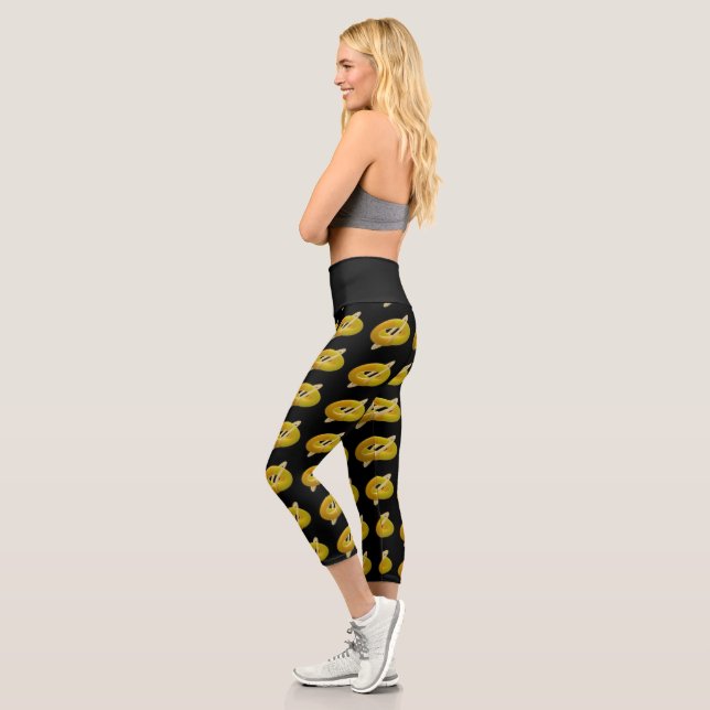 Lemon and cream design pattern on black capri leggings (Left)
