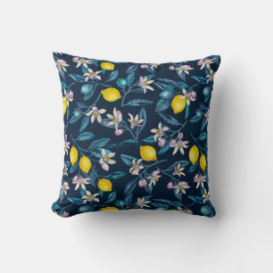 Lemon branches with blossoms and fruit on blue cushion