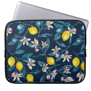 Lemon branches with blossoms and fruit on blue laptop sleeve
