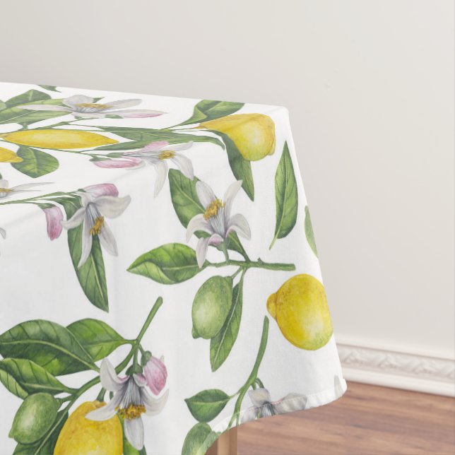Lemon branches with blossoms and fruit on white tablecloth (In Situ)