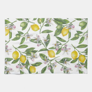 Lemon branches with blossoms and fruit on white tea towel