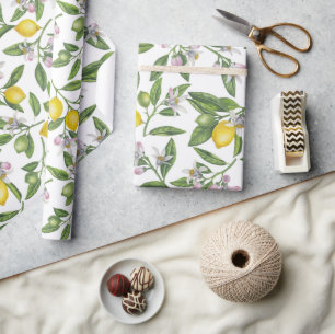 Lemon branches with blossoms and fruit on white wrapping paper