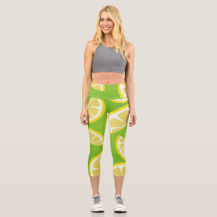 Lemon Slices on Lime Green Background Capri Leggings