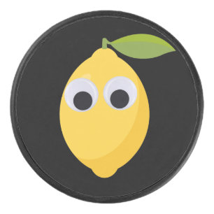 Lemon, sweet fruit with googly eyes hockey puck