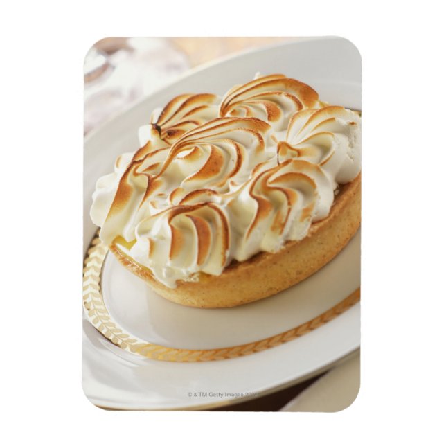 Lemon tart with baked meringue on plate magnet (Vertical)