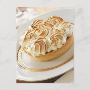 Lemon tart with baked meringue on plate postcard