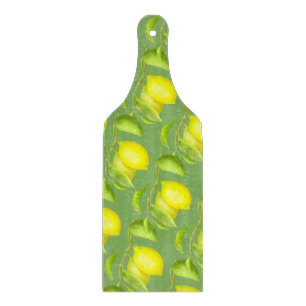 Lemons on a branch cutting board