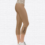 Leopard Pattern Om Symbol Capri Leggings<br><div class="desc">Leopard pattern Om symbol is tiled on the waistband, the capri leggings are light brown. Name in black on outside of right calf. Easily change or remove name using the Template provided. There is ample room for a full name or other text. Sizes from XS (0-2) to XL (16) I...</div>