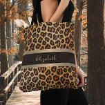 Leopard Print Pattern Brown and Gold Stripe Name Tote Bag<br><div class="desc">Strut in Style with Our Leopard Print Pattern Brown and Gold Stripe Name Tote Bag! Elevate your everyday carry with this chic and sophisticated tote bag. Featuring a luxurious brown bronze leopard skin pattern and a glamourous gold foil and brown stripe, this tote can be personalised with your name in...</div>