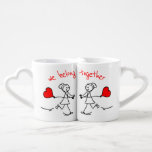 Lesbian Couple's We Belong Together Gift Coffee Mug Set<br><div class="desc">Celebrate the beauty of love with this cute lesbian couple's mug set, designed to honour meaningful relationships with warmth and whimsy. Featuring two joyful stick-figure women holding hands and red heart balloons, the design is brought to life with playful hand-drawn elements and vibrant red accents. The heartfelt message “we belong...</div>