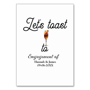 Let's toast to engagement party name date glass table number