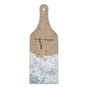 LETTERS IN THE SAND T CUTTING BOARD