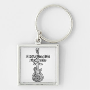 Life begins after playing the guitar. black & whit key ring