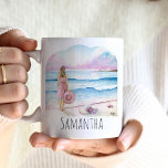 Life is Better at the Beach Personalised Coffee Mug<br><div class="desc">These beautiful personalised coffee mugs features a serene watercolor design of a woman standing by the shoreline, holding a beach hat, with soft shades of pink and blue evoking a serene ocean scene. The words "Life is better at the beach" are elegantly inscribed in trendy script typography. Use the template...</div>