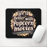 Life Is Better with Popcorn & Movies Retro Design Mouse Pad<br><div class="desc">This bold and nostalgic design celebrates the magic of movie nights with a playful vintage cinema aesthetic. Featuring rich typography surrounded by buttery popcorn, glowing marquee lights, and a classic film reel, this artwork evokes the cosy joy of settling in for a great film. The deep tones and retro-inspired lettering...</div>
