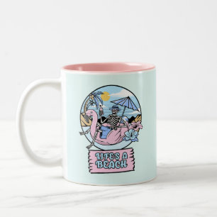 Life’s a Beach Skeleton Flamingo Float Two-Tone Coffee Mug