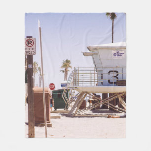 Lifeguard houses under bright skty fleece blanket