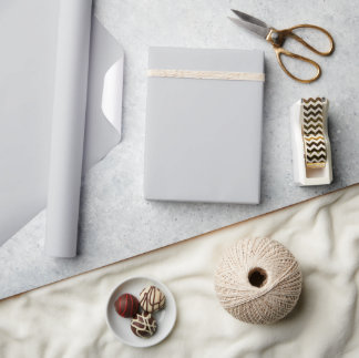light grey sheet or backdrop wrapping paper