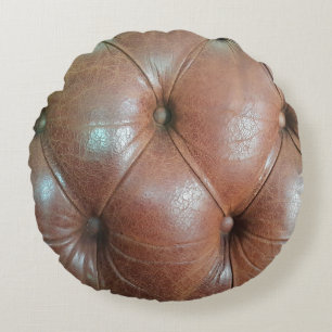 Light on brown leather sofa surface, textureabstra round cushion