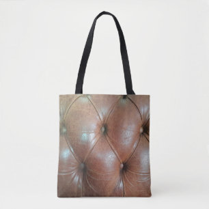 Light on brown leather sofa surface, textureabstra tote bag