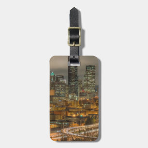 Light streaks from cars at night luggage tag