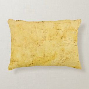 light yellow abstract textured plaster on the wall decorative cushion