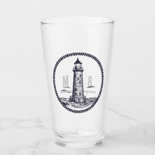Lighthouse at the sea in round rope frame glass