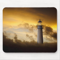 Lighthouse Glowing under Dramatic Sky