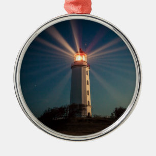 Lighthouse on a Hill Shining at Night Metal Ornament