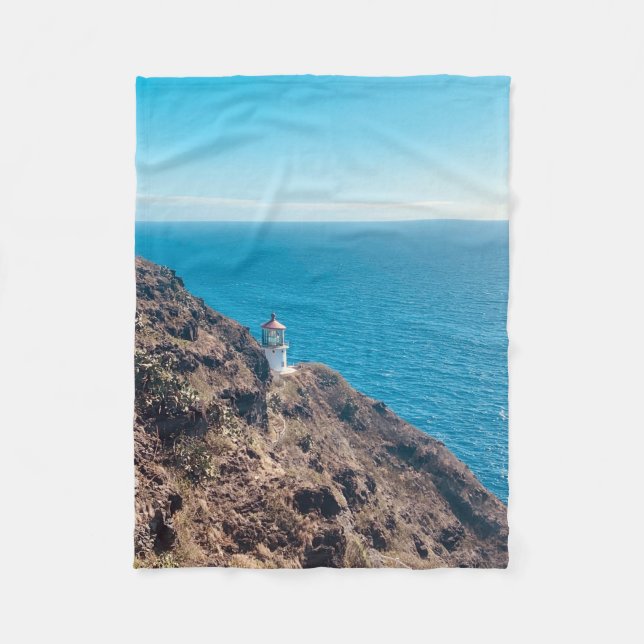lighthouse on cliff blue ocean Hawaii Fleece Blanket (Front)