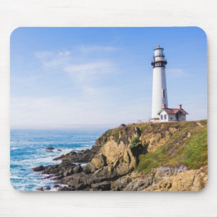 Lighthouse on hill blue sky white house ocean mouse pad