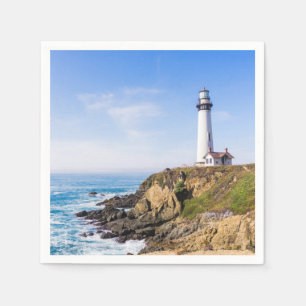 Lighthouse on hill blue sky white house ocean napkin