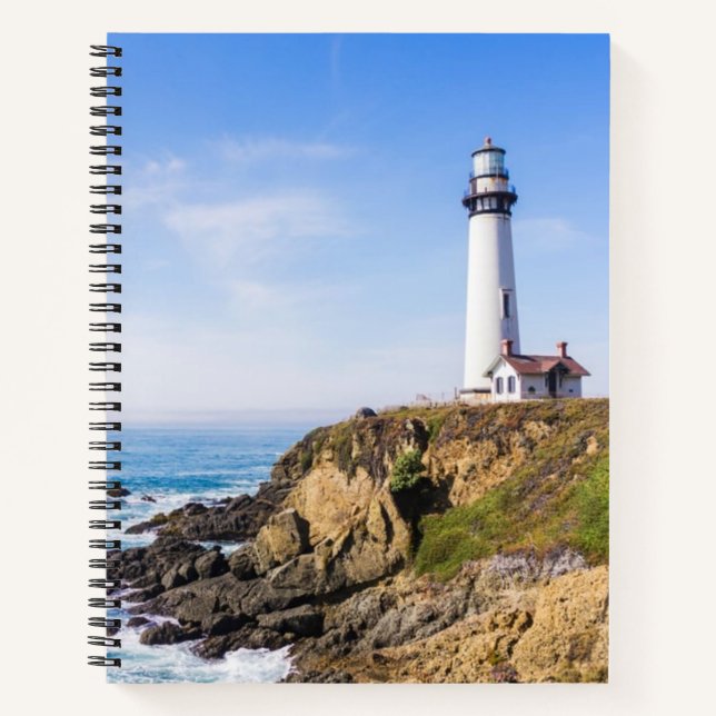 Lighthouse on hill blue sky white house ocean notebook (Front)