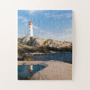 Lighthouse on Rocks with Ocean Reflection Jigsaw Puzzle