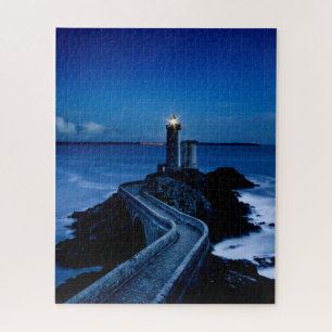 Lighthouse on wall in ocean at night jigsaw puzzle