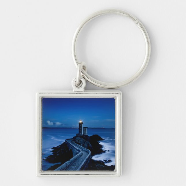 Lighthouse on wall in ocean at night key ring (Front)