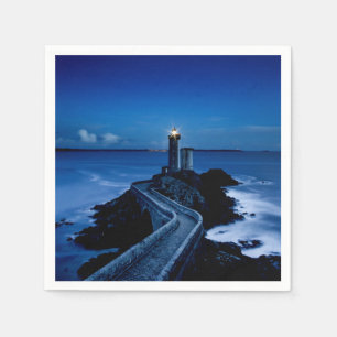 Lighthouse on wall in ocean at night napkin